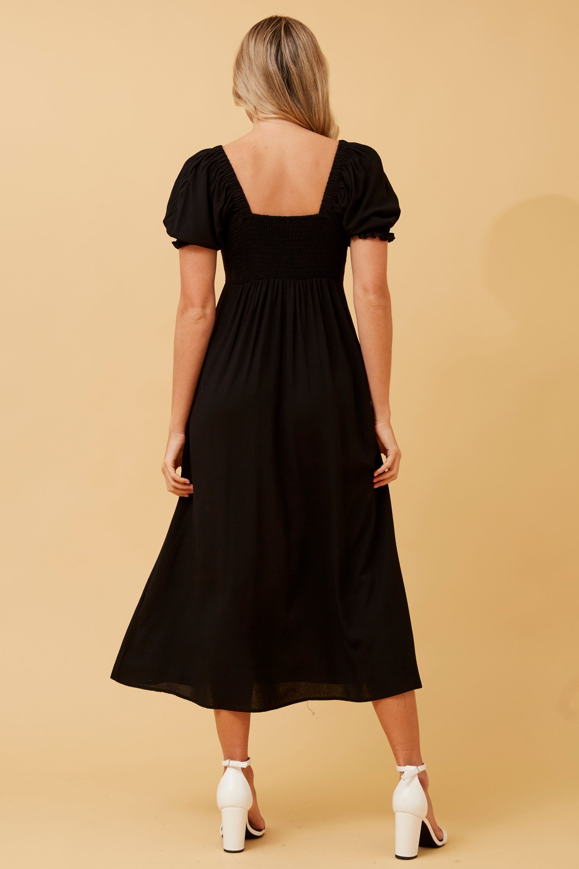 Chic black midi bow front dress with puff sleeves