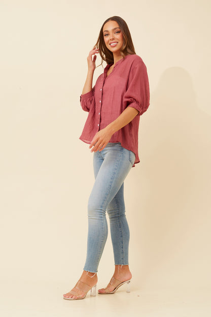 Upgrade your wardrobe with the Belina Solid Shirt. Comfortable, relaxed fit and modern back button detail make this plain shirt perfect for casual or smart styling.