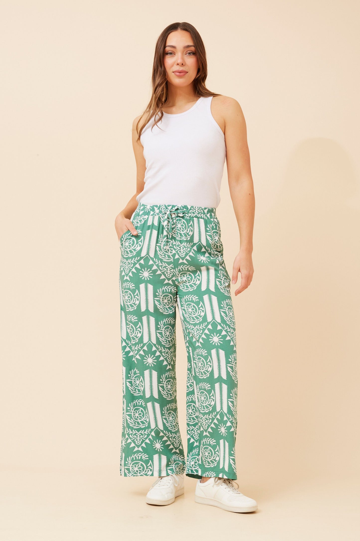 Elevate your casual wardrobe with SUZZEL abstract print pants in green