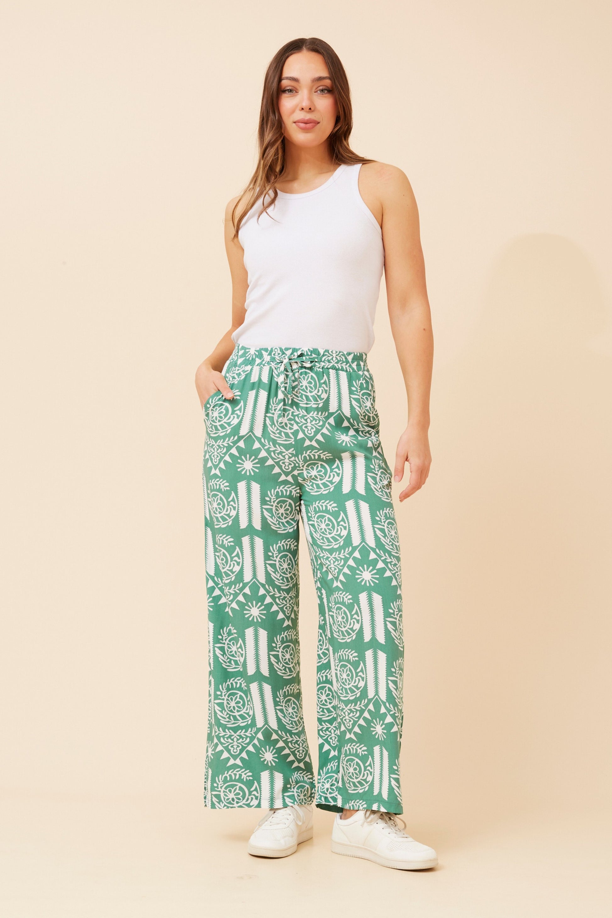 Elevate your casual wardrobe with SUZZEL abstract print pants in green