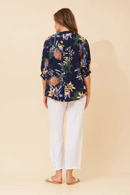 Shop the BELINA navy floral blouse featuring a breezy relaxed fit, partial button-down front, and lightweight breathable fabric.